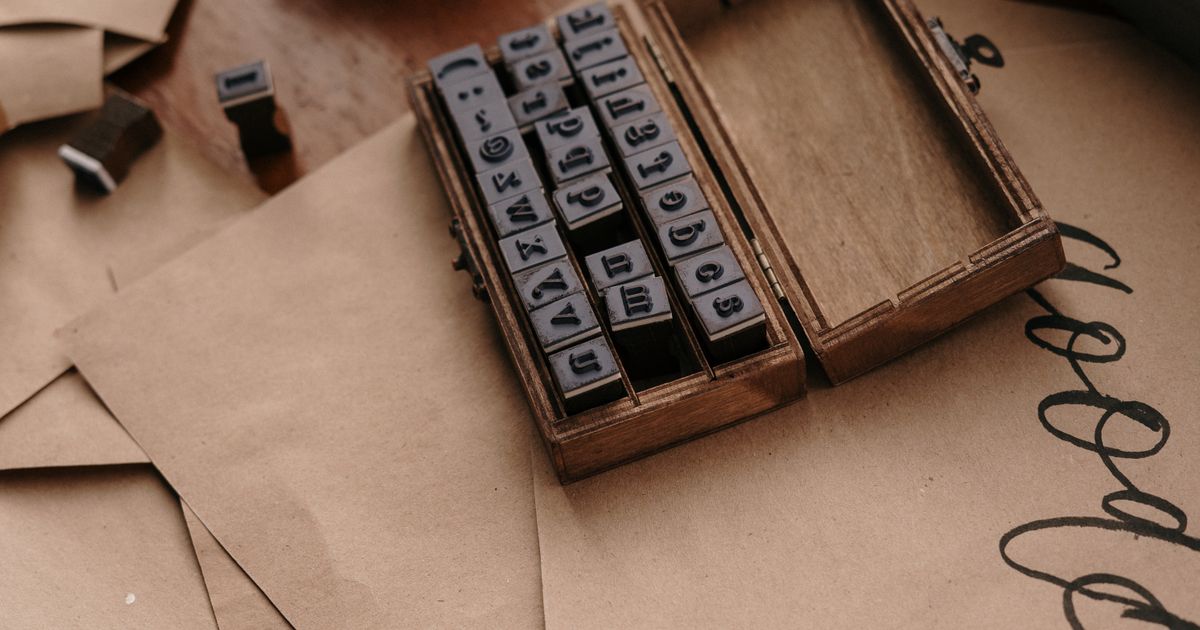A wooden box of rubber alphabet stamps