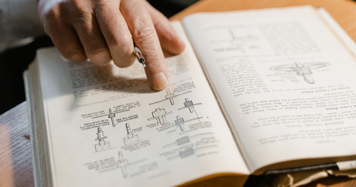 An open technical manual with diagrams