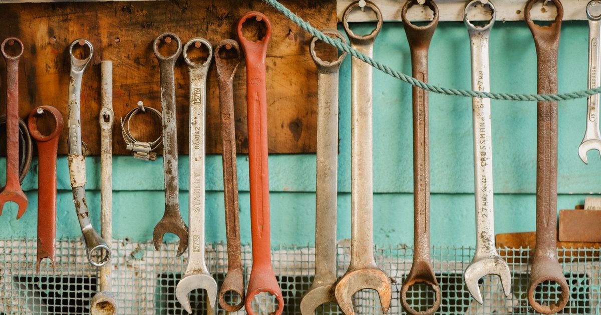 Spanners hanging in a row on a workshop wall