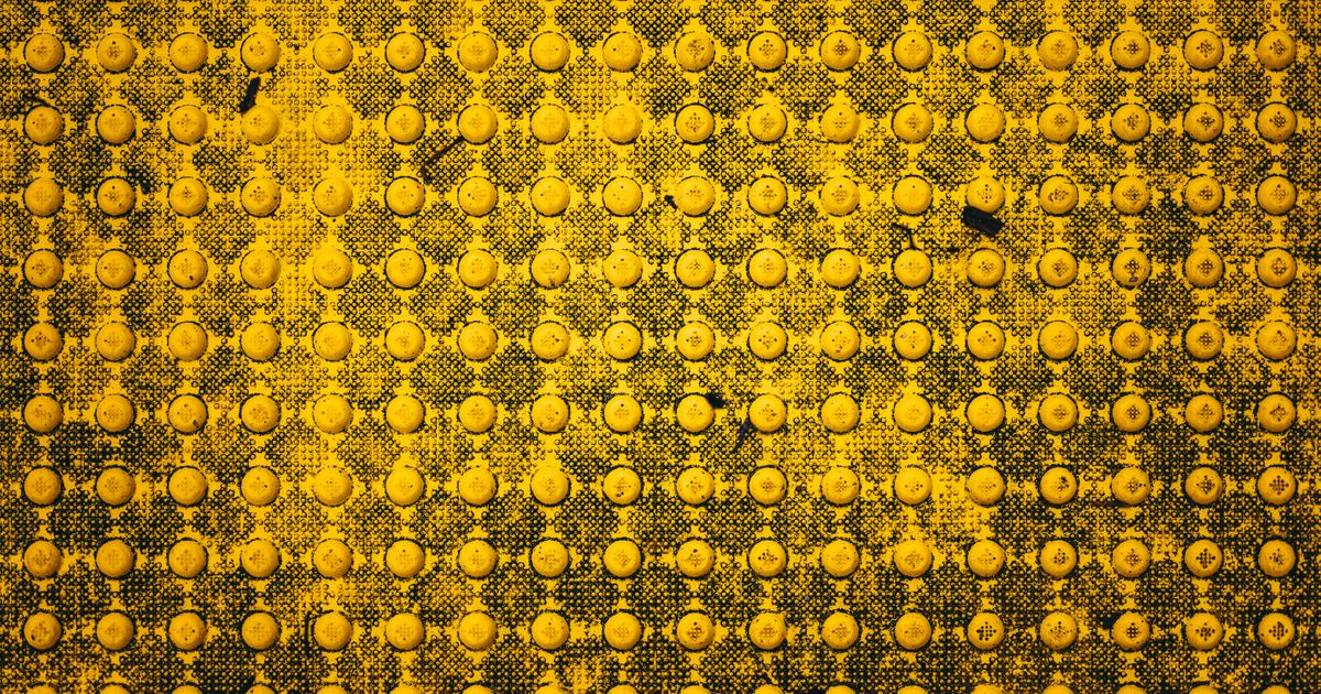 Tactile paving strip on a pavement